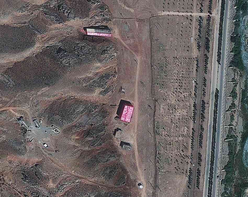 A photo from Aug. 15, 2012, supplied by the Institute for Science and International Security, shows buildings at the Parchin military base south of Tehran, Iran, shrouded in pink tarps. It's believed to be an effort to stop the U.N nuclear agency from monitoring the site, which is suspected of being used for secret work on atomic weapons.