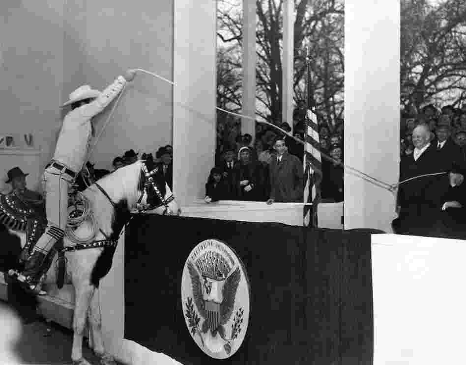 Television cowboy and roping legend Montie Montana lassoes President Eisenhower in the presidential reviewing box at the inaugural parade, 1953.