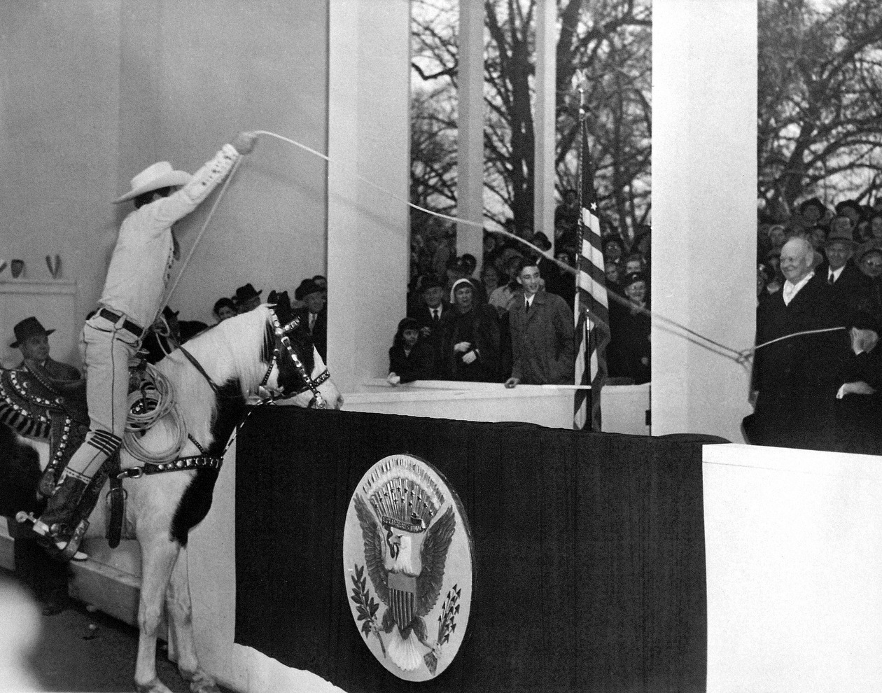 Television cowboy and roping legend Montie Montana lassoes President Eisenhower in the presidential reviewing box at the inaugural parade, 1953.