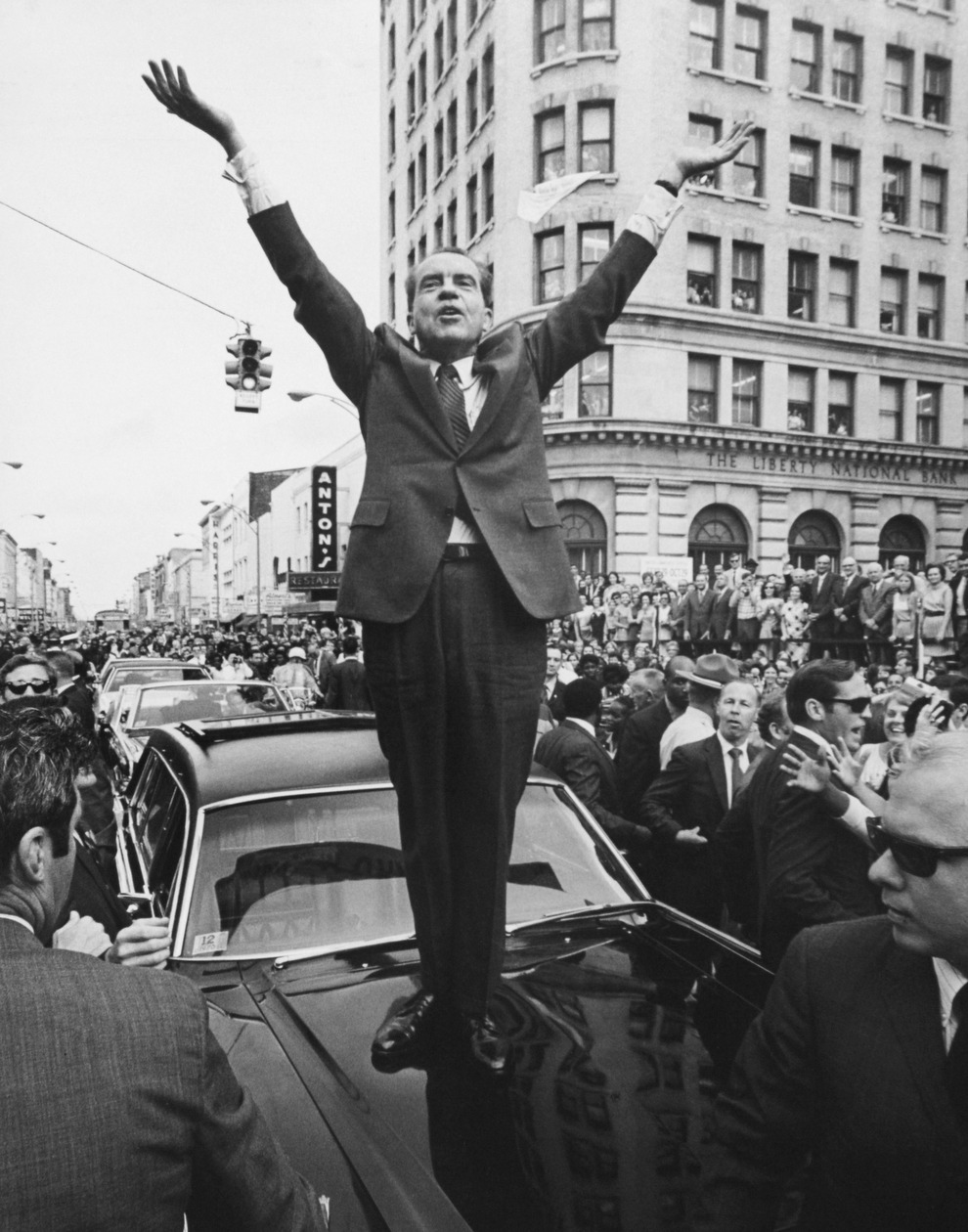 President Nixon stands on a car as he campaigns in 1960.