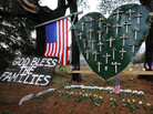 A memorial stands in a yard near the Sandy Hook Elementary School a month after the mass shooting that left 27 dead, including 20 children, in Newtown, Conn. A memorial stands in a yard near the Sandy Hook Elementary School a month after the mass shooting that left 27 dead, including 20 children, in Newtown, Conn.