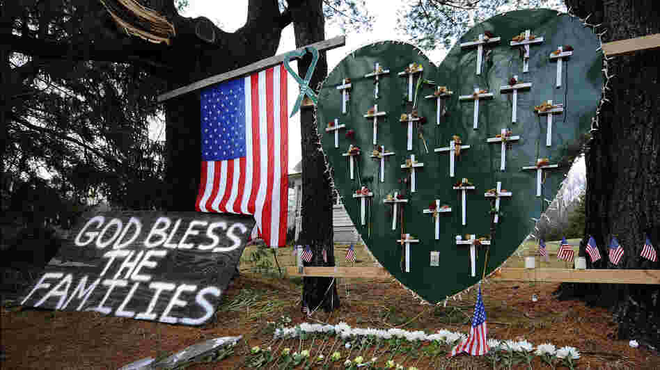 A memorial stands in a yard near the Sandy Hook Elementary School a month after the mass shooting that left 27 dead, including 20 children, in Newtown, Conn.