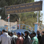 People gather Friday outside a hospital in eastern Algeria as they try to get information on those wounded during a military raid on a gas plant where Islamic extremists were holding hostages.