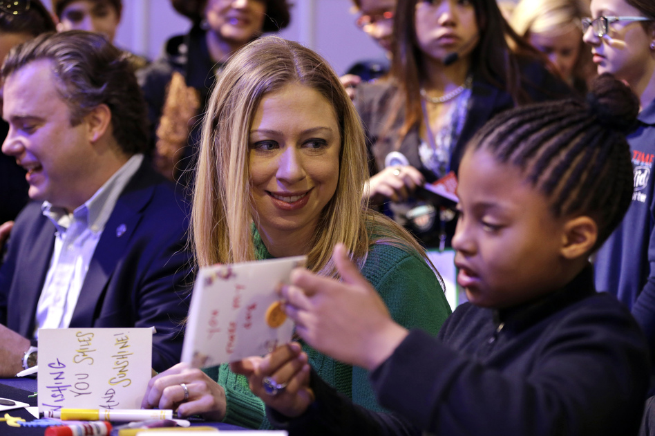Chelsea Clinton makes cards with 8-year-old Addison Rose on the National Mall on Saturday as part of the National Day of Service events. Clinton, daughter of former President Bill Clinton and Secretary of State Hillary Clinton, is the honorary chair of the National Day of Service.