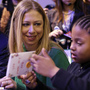 Chelsea Clinton makes cards with 8-year-old Addison Rose on the National Mall on Saturday as part of the National Day of Service events. Clinton, daughter of former President Bill Clinton and Secretary of State Hillary Clinton, is the honorary chair of the National Day of Service.