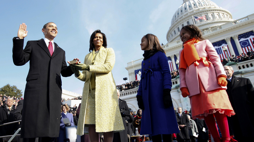 Barack Obama (left) takes the oath of office from Chief Justice John Roberts, not seen, as his wife Michelle, holds the Lincoln Bible and daughters Sasha, right and Malia, watch at the U.S. Capitol in Washington on Jan. 20, 2009.