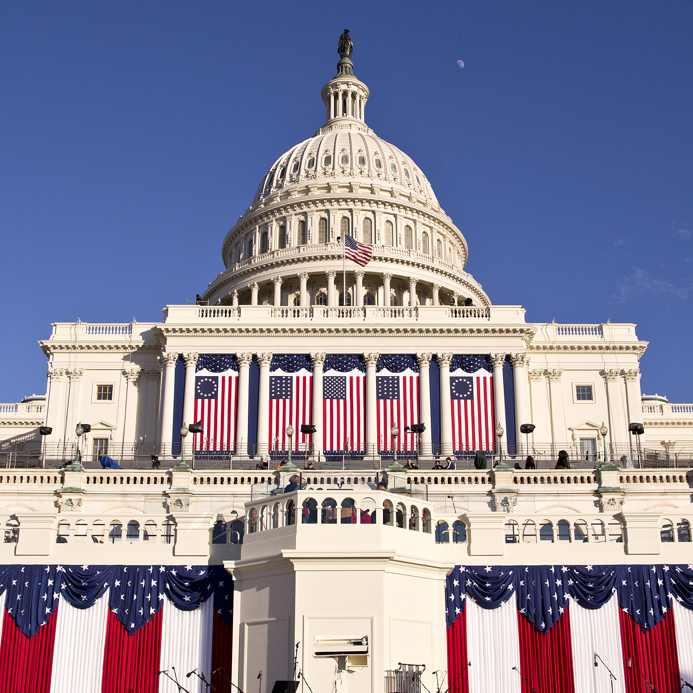 The West Front of the U.S. Capitol is dressed in red, white and blue the day before President Obama's public inauguration festivities, in Washington on Sunday.
