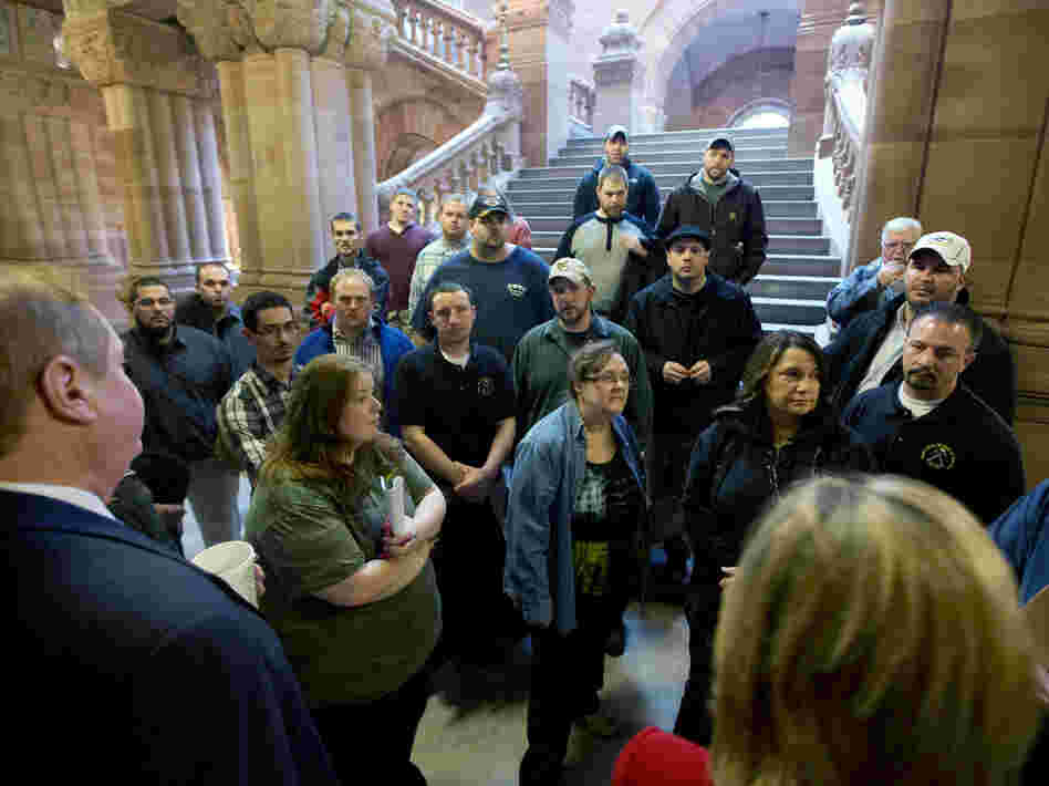 Workers from Remington Arms Company in Ilion, N.Y., talk with Assemblyman Marc Butler and Assemblywoman Claudia Tenney about gun legislation at the Capitol on Jan. 14 in Albany, N.Y.