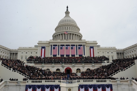 Obama and Biden listen to the invocation by Myrlie Evers-Williams.