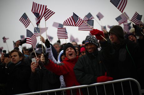 Spectators react on the National Mall during the 57th inauguration ceremony for President Obama.