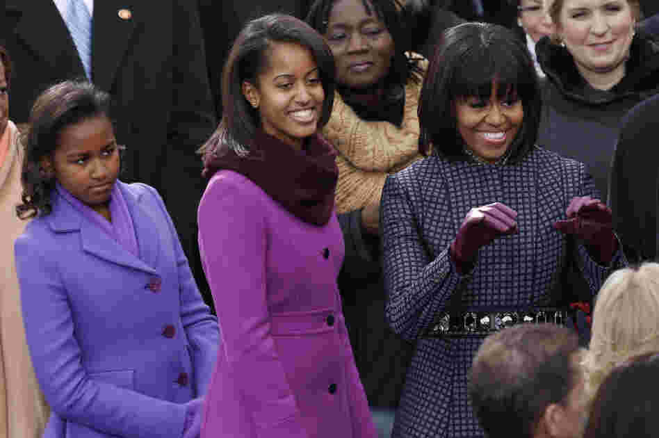 The first lady and her daughters arrive for the swearing-in of President Obama at the Capitol.