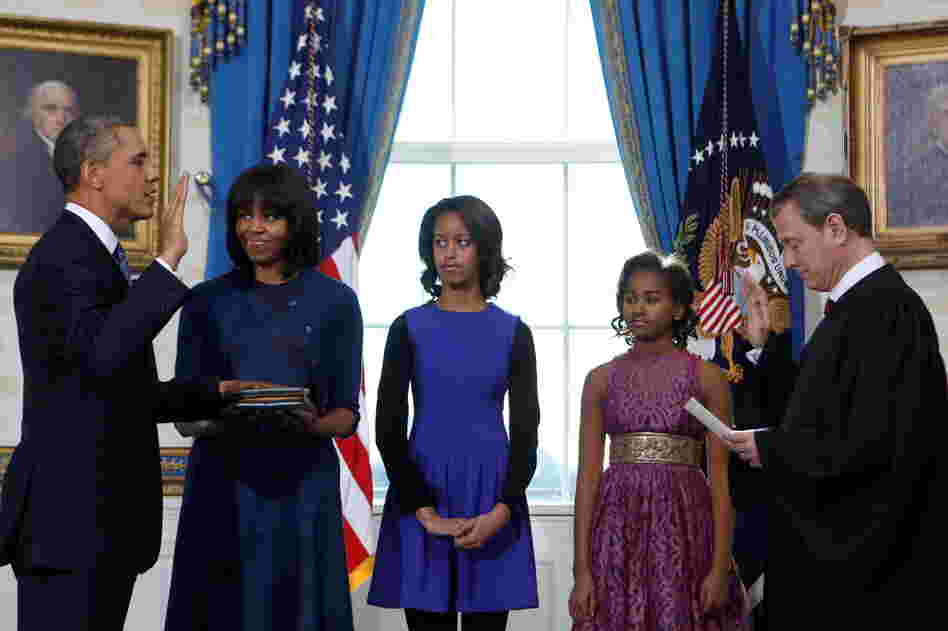 On Sunday, during the official swearing-in ceremony at the White House, the first lady wore a dress and cardigan by Reed Krakoff. Women's Wear Daily reports she wore the same cardigan on Monday.