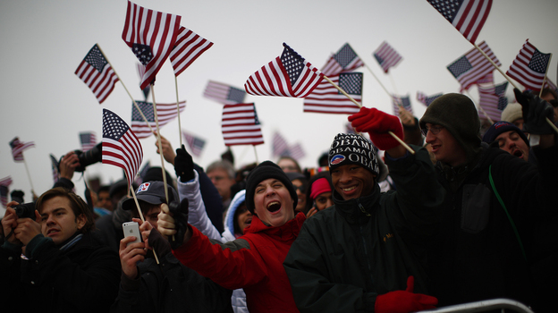 Spectators react on the National Mall during inauguration ceremonies for President Obama.