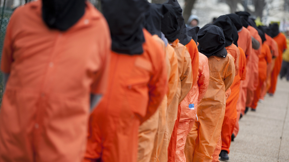 Demonstrators, dressed as detainees, march on Jan. 11 against the U.S. military detention facility in Guantanamo Bay, Cuba, and call for President Obama to close the facility.