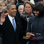 President Obama taking the oath of office today on the steps of the Capitol. First Lady Michelle Obama held the two Bibles on which he placed his hand.