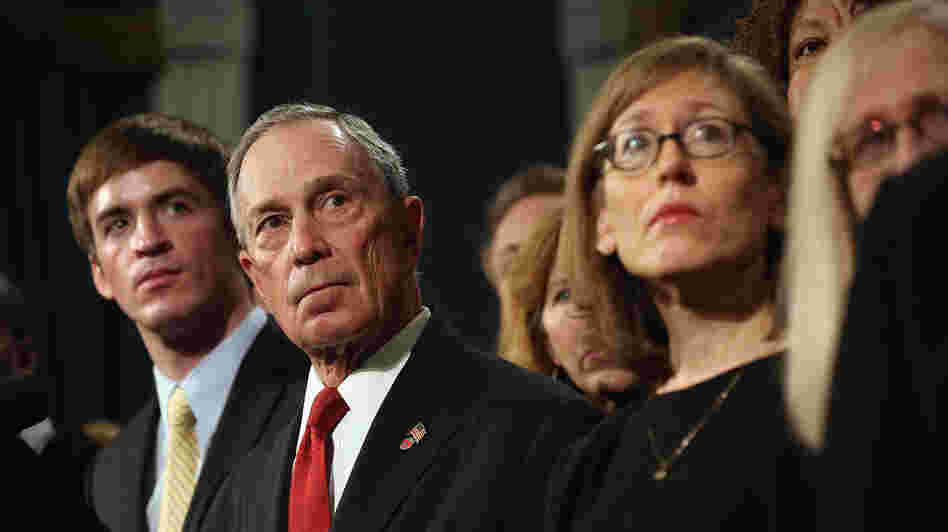 At a news conference last month, New York City Mayor Michael Bloomberg stands with people who have been affected by gun violence.