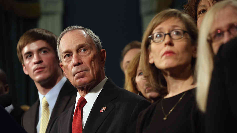 At a news conference last month, New York City Mayor Michael Bloomberg stands with people who have been affected by gun violence.