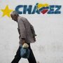 A man walks past a mural of Venezuelan President Hugo Chavez in Caracas, on Jan. 11.