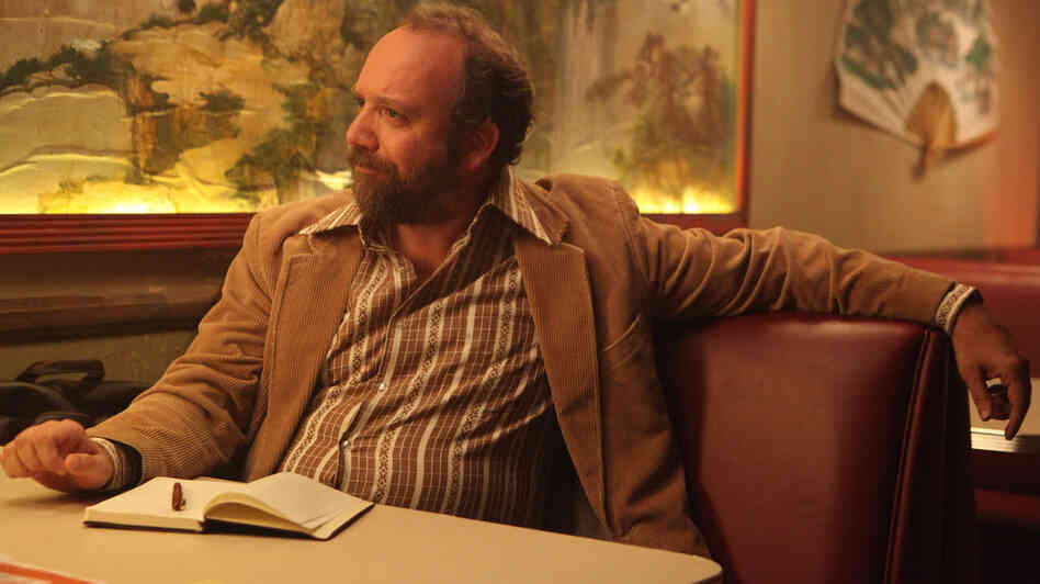 Journalist Arnie Blondestone (Paul Giamatti) interprets the bizarro story at the heart of the too-twisty horror fantasy John Dies at the End. Journalist Arnie Blondestone (Paul Giamatti) interprets the bizarro story at the heart of the too-twisty horror fantasy John Dies at the End.