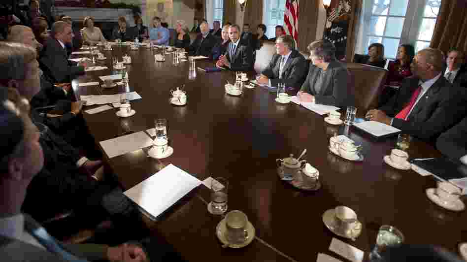 President Barack Obama, center, makes a statement to the media before the start of a meeting with his Cabinet on Nov. 28, 2012.