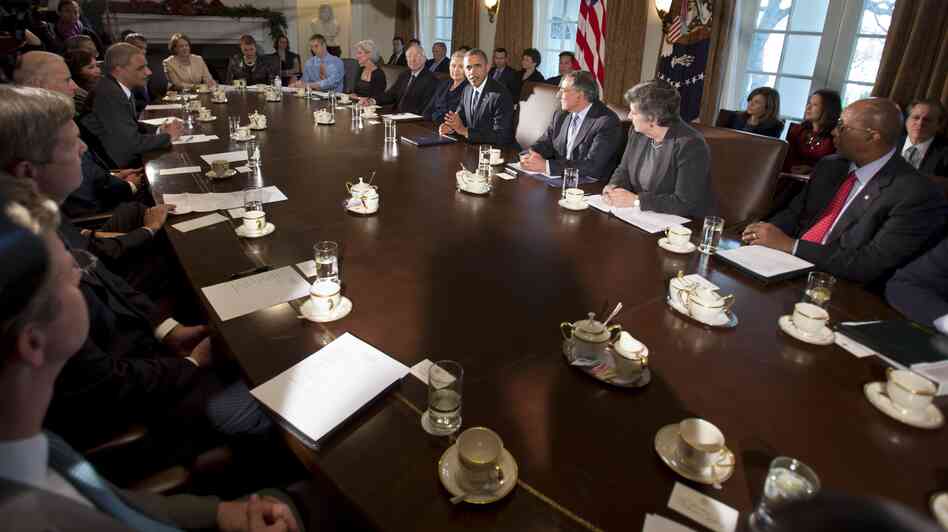 President Barack Obama, center, makes a statement to the media before the start of a meeting with his Cabinet on Nov. 28, 2012.