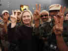Secretary of State Hillary Clinton stands with Libyan fighters who ousted Moammar Gadhafi during an Oct. 18, 2011, visit to Libya. Clinton was a strong supporter of U.S. intervention in Libya. Secretary of State Hillary Clinton stands with Libyan fighters who ousted Moammar Gadhafi during an Oct. 18, 2011, visit to Libya. Clinton was a strong supporter of U.S. intervention in Libya.
