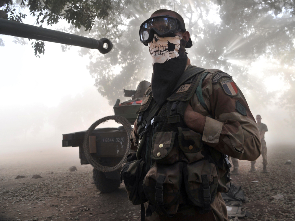 This isn't the sort of picture of a French soldier that his commanders want to see. Photographer Issouf Sanogo says troops were protecting their faces from dust kicked up by a helicopter landing in central Mali on Sunday.
