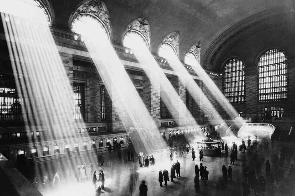 Beams of sunlight stream through the windows of Grand Central Terminal, circa 1930.
