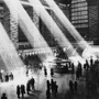 Beams of sunlight stream through the windows of Grand Central Terminal, circa 1930.