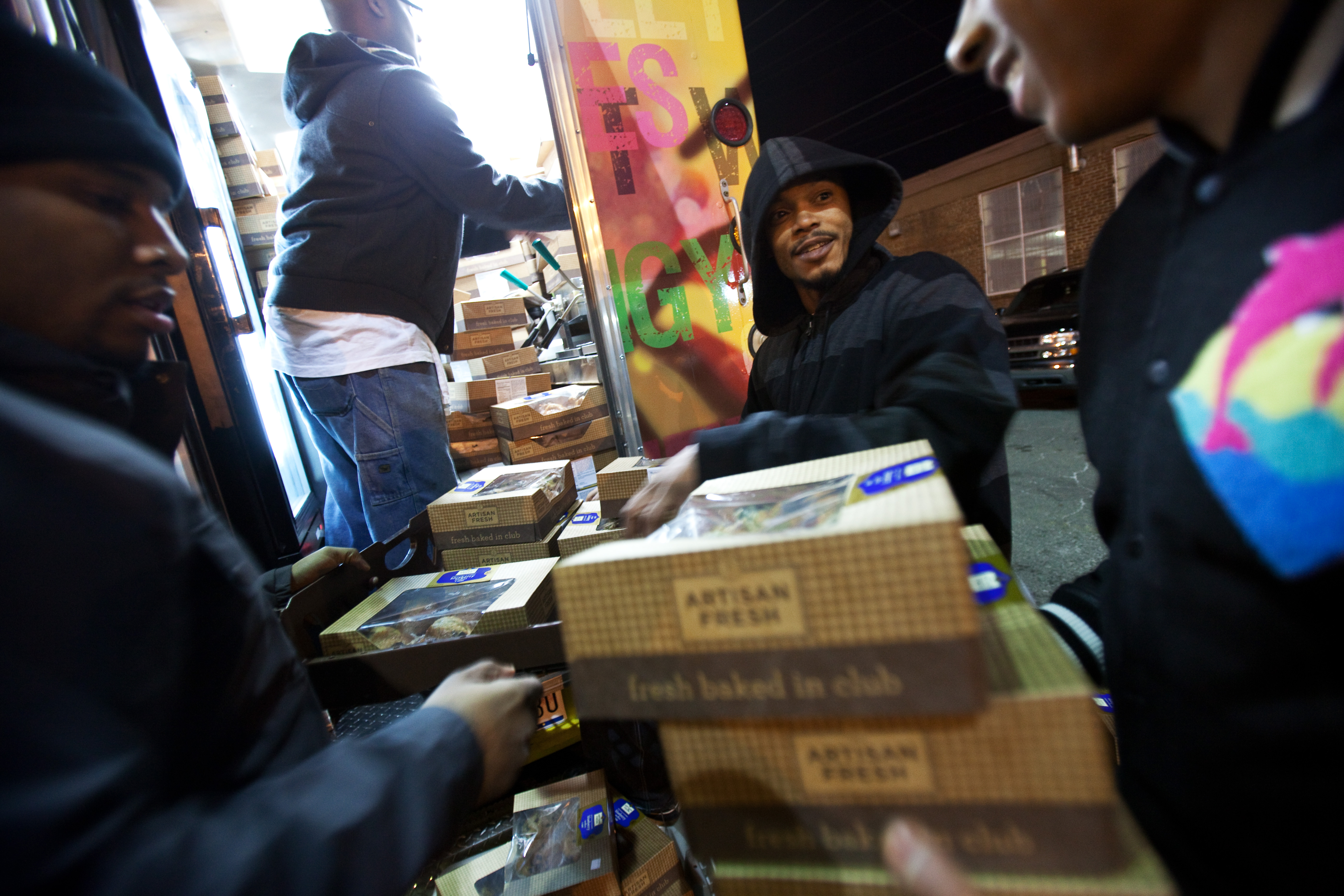 Al Lebron (center) helps friends stuff almost 250 muffin boxes into the Capital Chicken and Waffles Food Truck the night before the inauguration ceremonies. This was the first time that many food trucks were allowed along the parade route. Due to security measures, each truck was only allowed to serve whatever food could be secured in the truck that morning. Al Lebron (center) helps friends stuff almost 250 muffin boxes into the Capital Chicken and Waffles Food Truck the night before the inauguration ceremonies. This was the first time that many food trucks were allowed along the parade route. Due to security measures, each truck was only allowed to serve whatever food could be secured in the truck that morning.