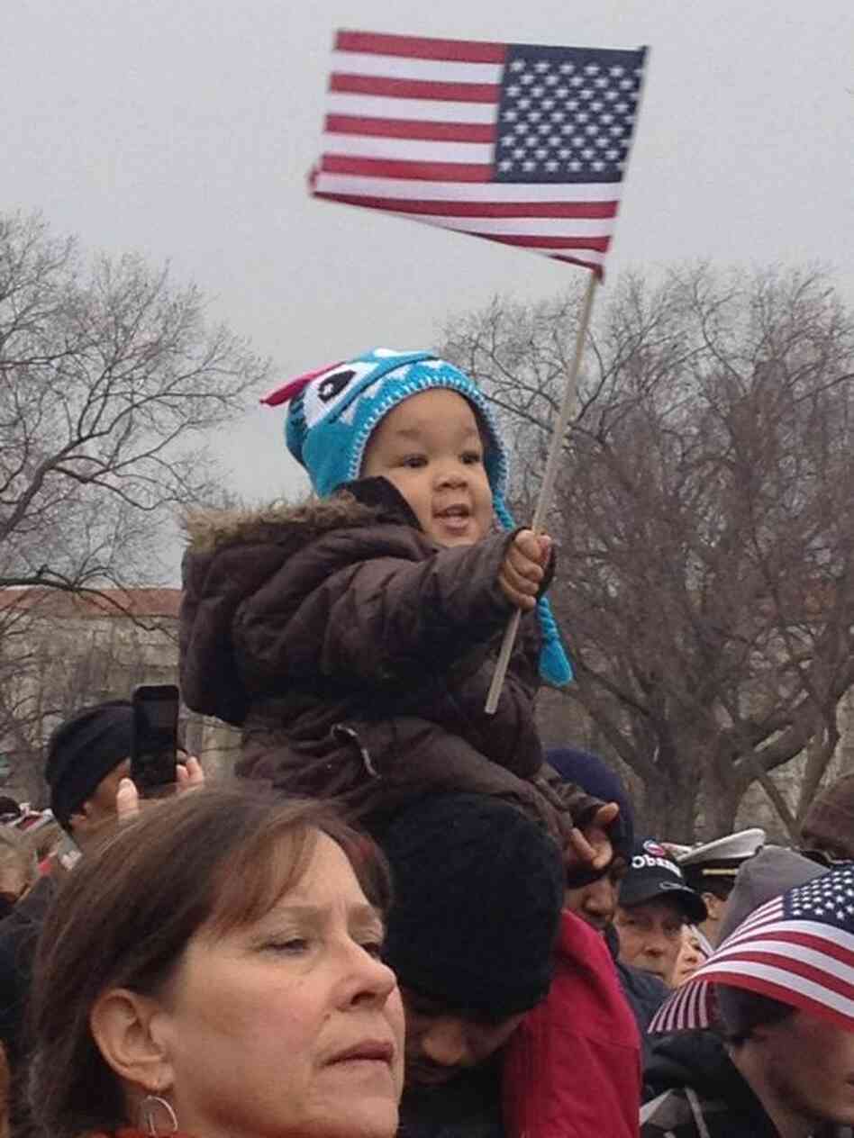 Standing among the crowd at the inaugural parade, All Things Considered Host Melissa Block snapped this photo of two-year-old Taniya Washington hoisted on her uncle's shoulders with an American flag. According to Block's tweet, Taniya's uncle told his nieces, "Y'all's next! You guys are the future!"