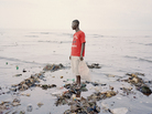 Momoh, 33, collects plastic bottles from the polluted beach of Kroo Bay, a poor slum settlement of 5,500 people in Freetown, Sierra Leone. In 2012, Sierra Leone suffered through one of its worst outbreaks of cholera, a waterborne disease that infects the intestine and is transmitted through contaminated water and food. The disease has ravaged 12 of the country's 13 districts. Momoh, 33, collects plastic bottles from the polluted beach of Kroo Bay, a poor slum settlement of 5,500 people in Freetown, Sierra Leone. In 2012, Sierra Leone suffered through one of its worst outbreaks of cholera, a waterborne disease that infects the intestine and is transmitted through contaminated water and food. The disease has ravaged 12 of the country's 13 districts.