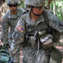 In a May 9, 2012 photo, Capt. Sara Rodriguez, 26, of the 101st Airborne Division, carries a litter of sandbags during the Expert Field Medical Badge training at Fort Campbell, Ky. Female soldiers are moving into new jobs in once all-male units as the U.S. Army breaks down formal barriers in recognition of what's already happened in wars in Iraq and Afghanistan. In a May 9, 2012 photo, Capt. Sara Rodriguez, 26, of the 101st Airborne Division, carries a litter of sandbags during the Expert Field Medical Badge training at Fort Campbell, Ky. Female soldiers are moving into new jobs in once all-male units as the U.S. Army breaks down formal barriers in recognition of what's already happened in wars in Iraq and Afghanistan.