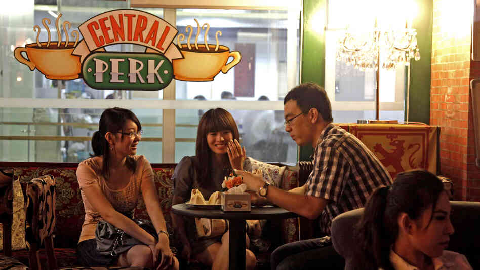 Customers chat at a Beijing cafe modeled after the Central Perk cafe in the hit American sitcom Friends, in 2010. Nearly a decade after the series ended, the popularity of Friends continues among young Chinese, who use the show as a language-learning tool and enjoy its depiction of young Americans.
