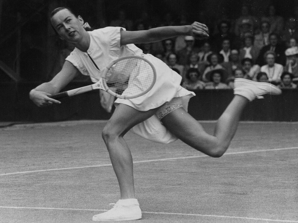 Gertrude Moran, "Gorgeous Gussie," playing at Wimbledon in 1949. Her attire, which included a bit of lace, shocked some.