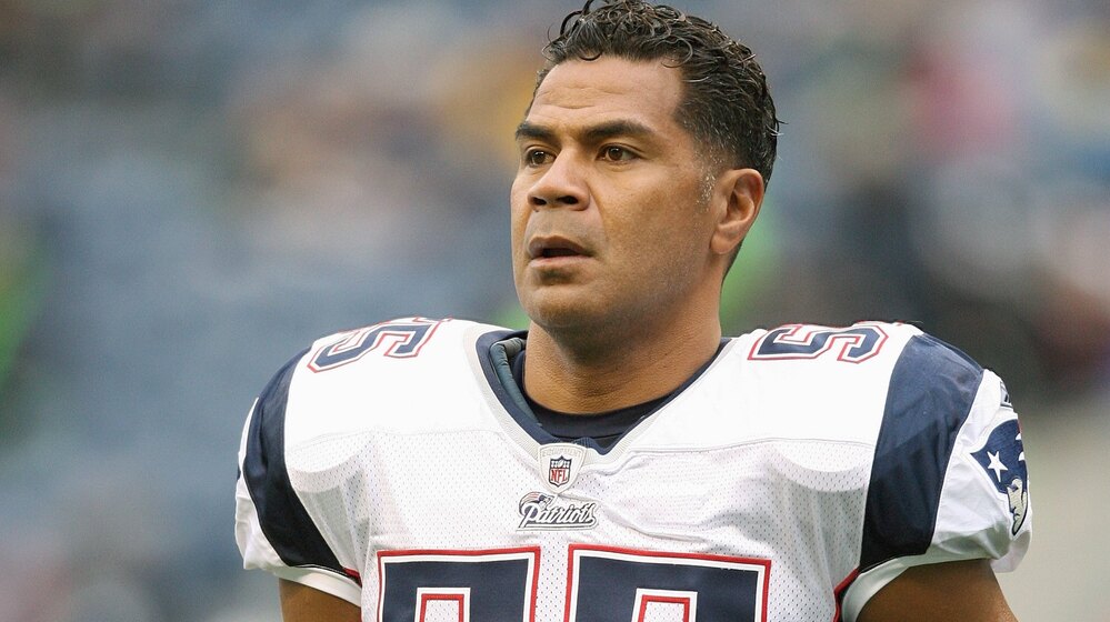 Junior Seau, seen here playing for the New England Patriots toward the end of his career, suffered from a degenerative brain disease, scientists say.