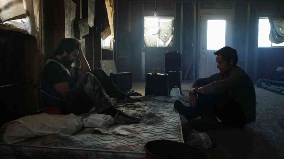 Chris (Vinny Curran) resists his friend Mike's (Peter Cilella) attempts to save him from drug addiction in the indie horror film Resolution. As unsettling intrusions into their rundown rural abode mount, however, they both might need a different kind of rescue. Chris (Vinny Curran) resists his friend Mike's (Peter Cilella) attempts to save him from drug addiction in the indie horror film Resolution. As unsettling intrusions into their rundown rural abode mount, however, they both might need a different kind of rescue.