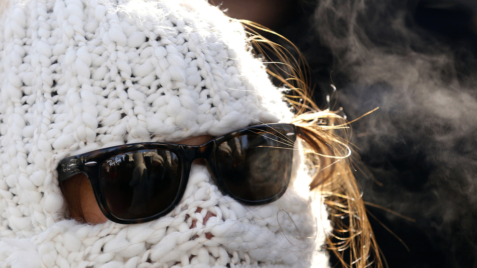 Julie Caruso of Akron, Ohio, was wrapped up Tuesday as she waited in line for a White House tour. It was well below freezing in the nation's capital. Temperatures were even lower in other parts of the nation.