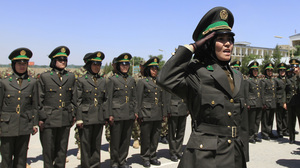 A female officer salutes during a graduation ceremony at the Kabul Military Training Center in Kabul June 13, 2012. Around 2000 Afghan soldiers and officers including 16 women graduated on Wednesday at the training center in Kabul.