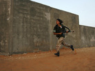 A female Israeli soldier runs during an urban warfare exercise at an army training facility near Zeelim, Israel, on June 19, 2008. A female Israeli soldier runs during an urban warfare exercise at an army training facility near Zeelim, Israel, on June 19, 2008.