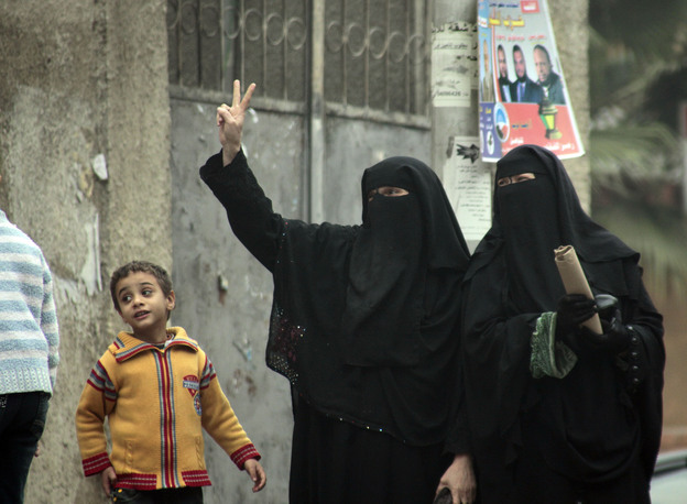 Female supporters of the Nour Party flash victory signs outside a polling station in Cairo on Jan. 30, 2012.
