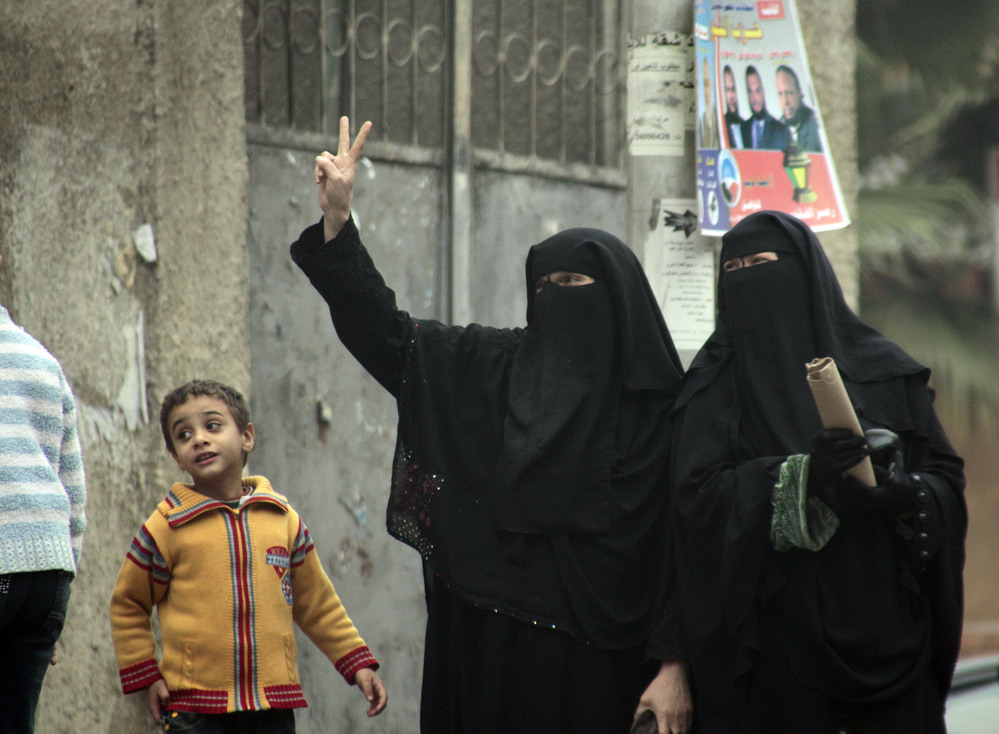 Female supporters of the Nour Party flash victory signs outside a polling station in Cairo on Jan. 30, 2012.