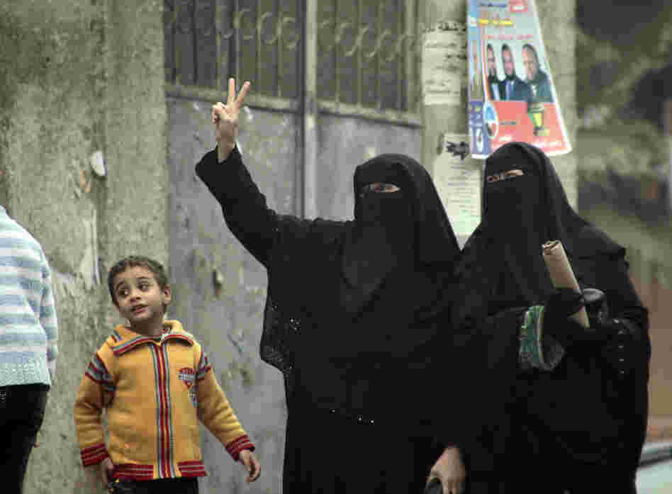 Female supporters of the Nour Party flash victory signs outside a polling station in Cairo on Jan. 30, 2012.