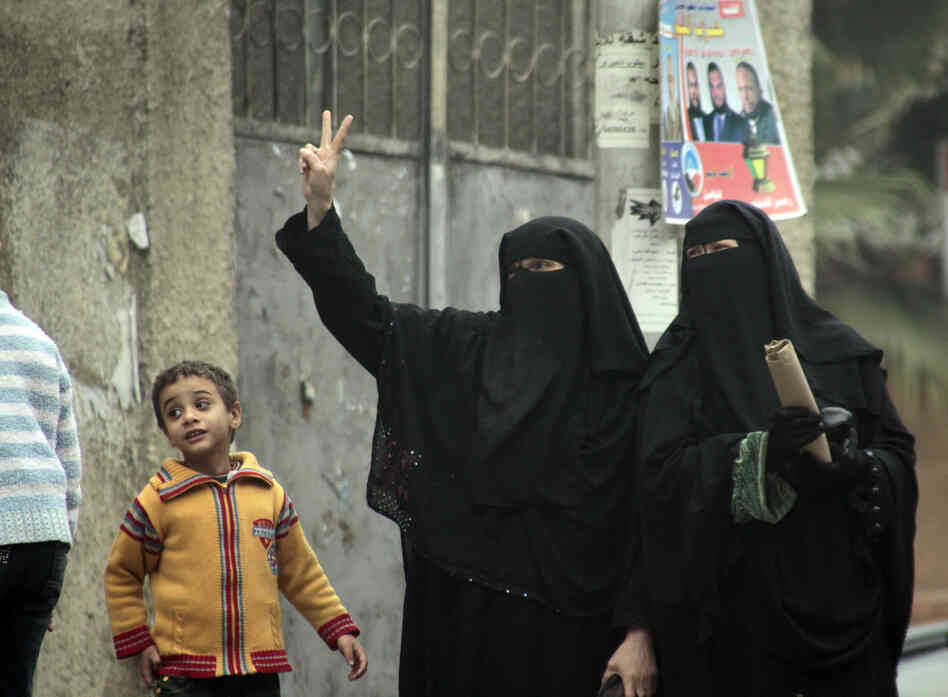 Female supporters of the Nour Party flash victory signs outside a polling station in Cairo on Jan. 30, 2012.
