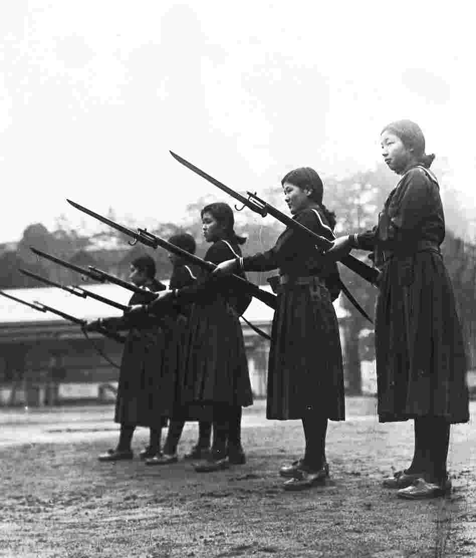 Young women learn how to charge an enemy with rifles and bayonets at their high school in Tokyo, Feb. 18, 1937. Japan trained women and girls for auxiliary army units.