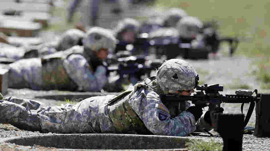 Female soldiers from 1st Brigade Combat Team, 101st Airborne Division train on a firing range in Fort Campbell, Ky., in preparation for their deployment to Afghanistan. The Pentagon announced Thursday that women will no longer be banned from combat roles.