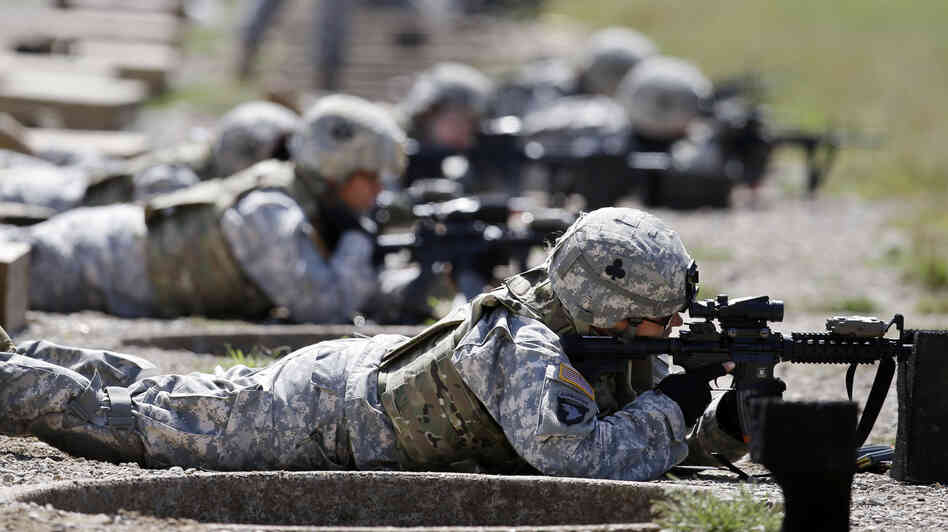 Female soldiers from 1st Brigade Combat Team, 101st Airborne Division train on a firing range in Fort Campbell, Ky., in preparation for their deployment to Afghanistan. The Pentagon announced Thursday that women will no longer be banned from combat roles.
