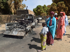 Malians gather around the remains of vehicles used by Islamist rebels that were destroyed by an earlier French airstrike, Jan. 23 in Diabaly, about 250 miles north of Bamako, Mali's capital. Malians gather around the remains of vehicles used by Islamist rebels that were destroyed by an earlier French airstrike, Jan. 23 in Diabaly, about 250 miles north of Bamako, Mali's capital.