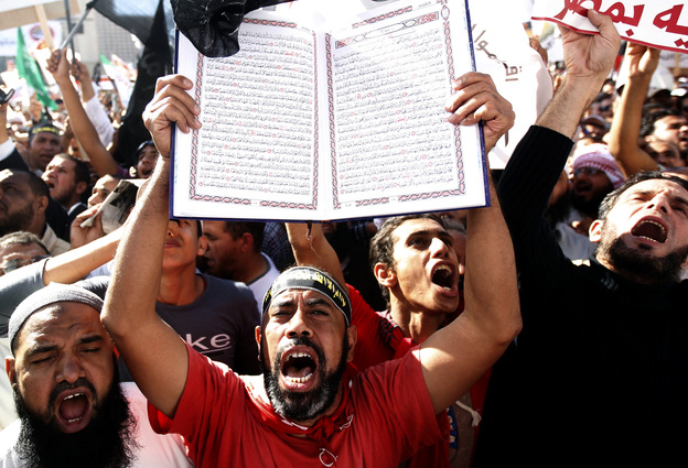A protester holds a Quran at a Salafi rally for the enforcement of Islamic Shariah law last fall in Cairo's Tahrir Square. Repressed during the rule of President Hosni Mubarak, the country's ultra-conservative Salafis have seen a resurgence since the Arab Spring uprising.