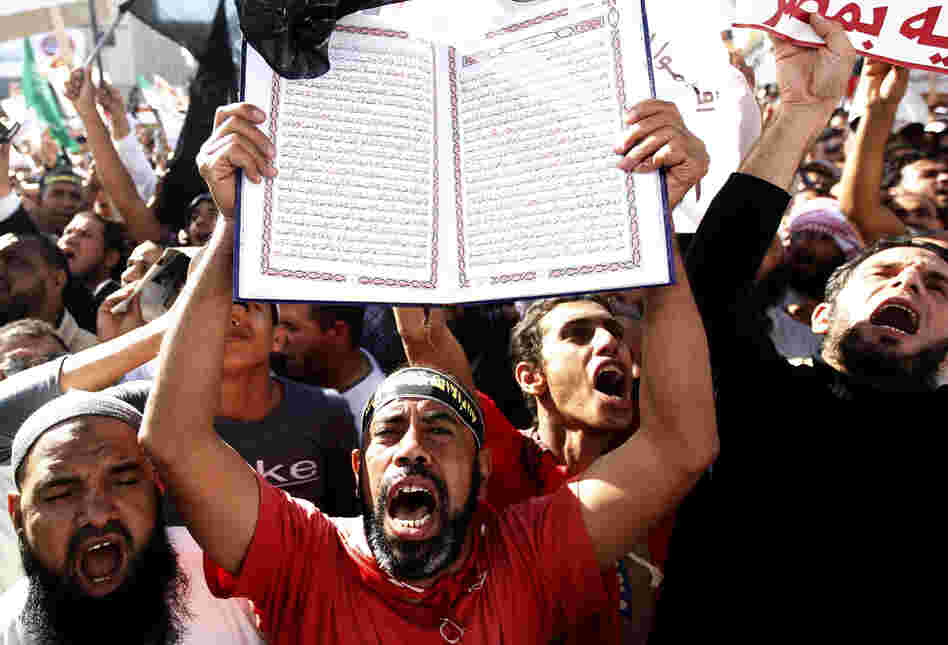 A protester holds a Quran at a Salafi rally for the enforcement of Islamic Shariah law last fall in Cairo's Tahrir Square. Repressed during the rule of President Hosni Mubarak, the country's ultra-conservative Salafis have seen a resurgence since the Arab Spring uprising.